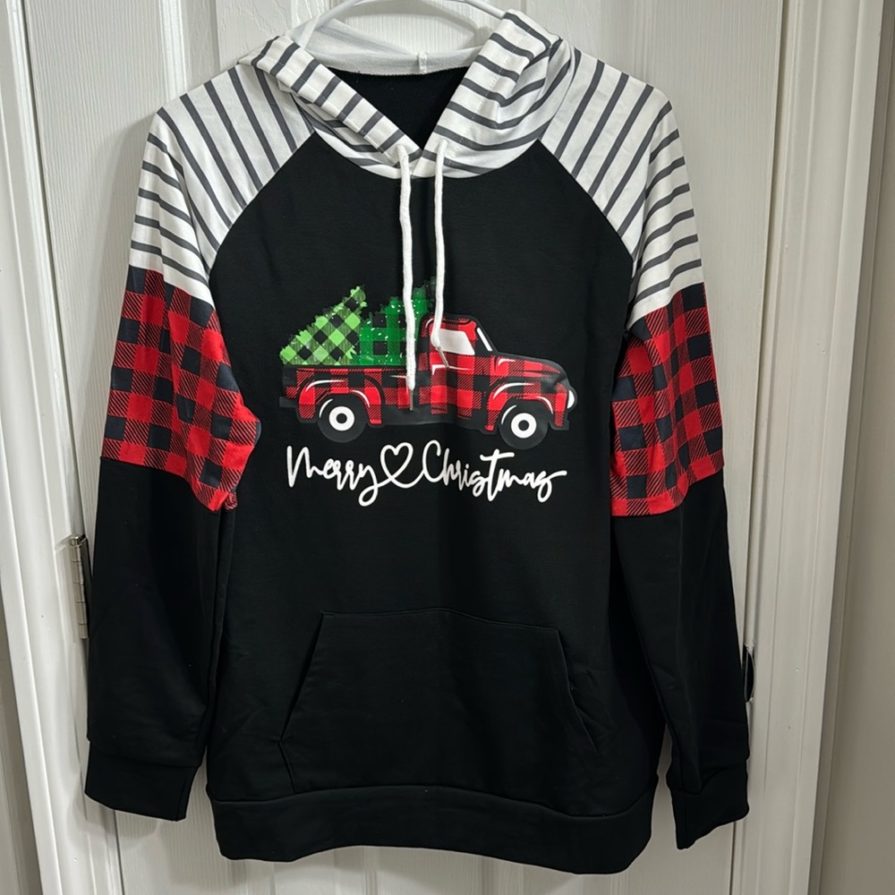 Brand new women’s holiday sweatshirt, size medium.